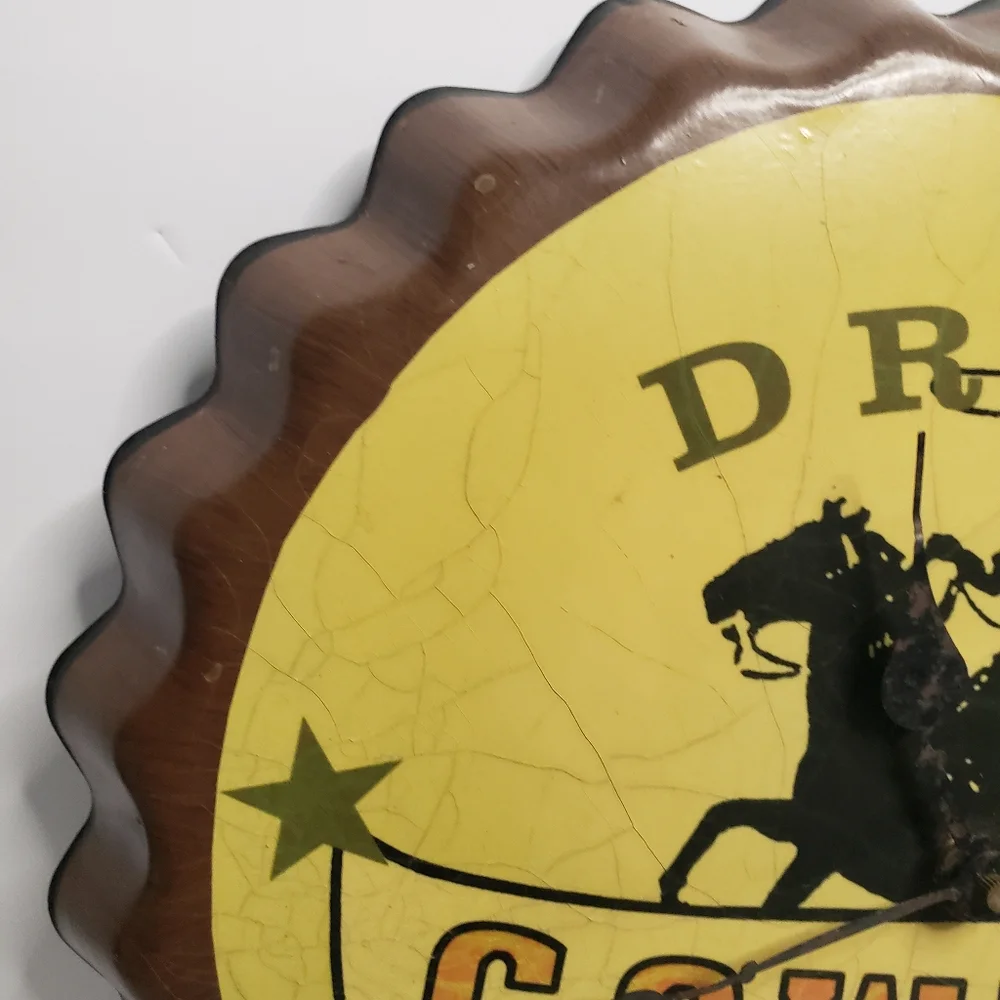 Metal Cowboy clock shaped like bottle cap. 191